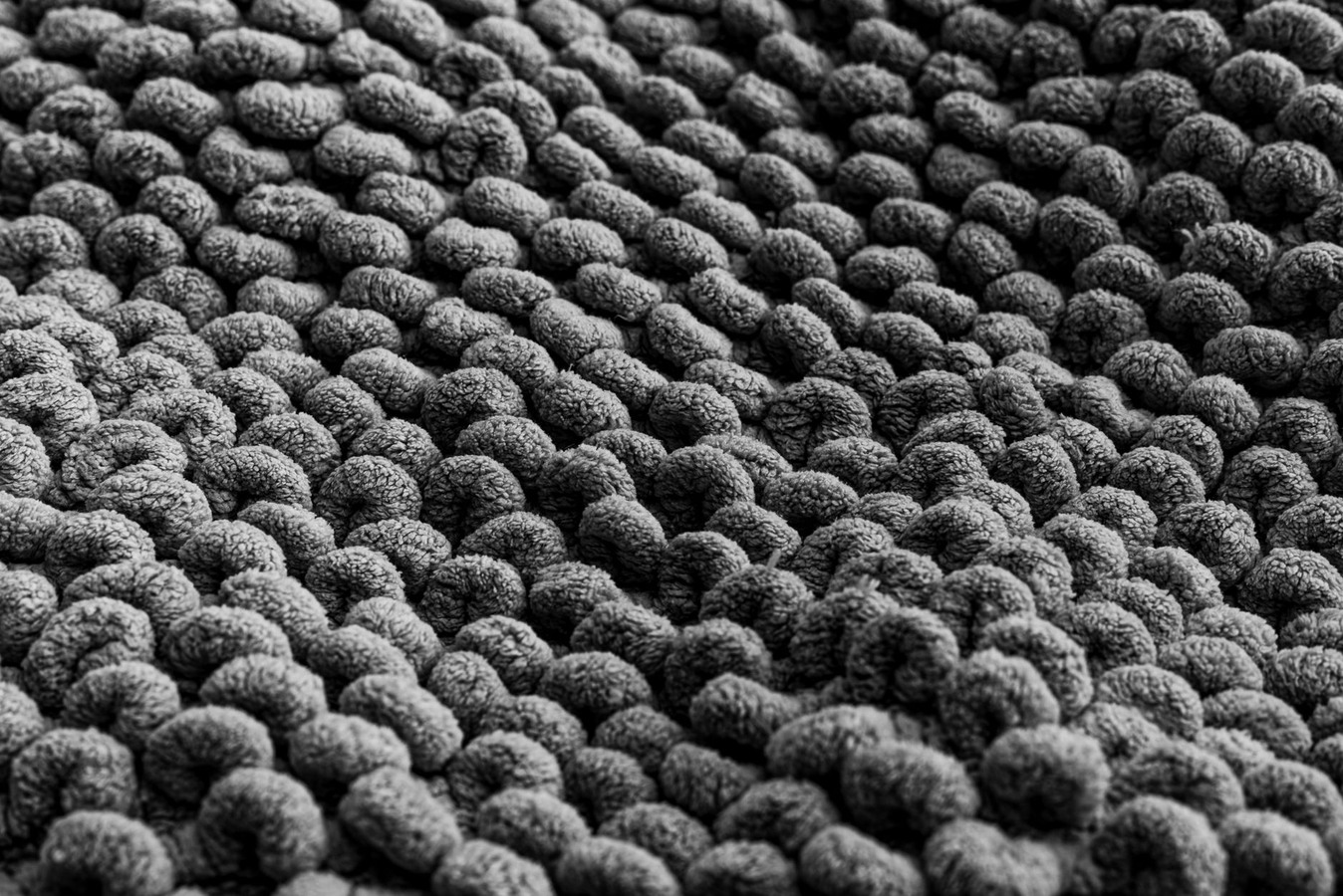 Pet stain damage showing discoloration and fiber matting before professional treatment